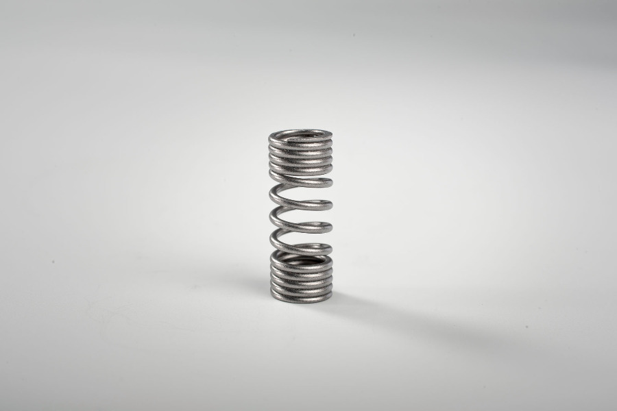 Druckfeder mit variablen Windungsabständen Druckfeder mit variablen Windungsabständen